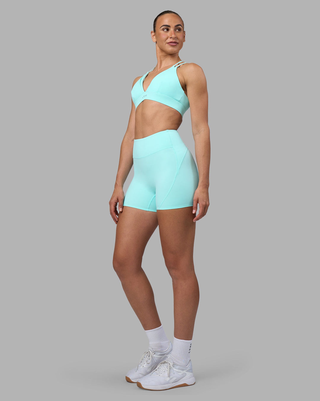 Woman wearing Rhythm Elixir Ultra High-Rise 4" Short - Island Paradise | Model:Sophie | Size:S