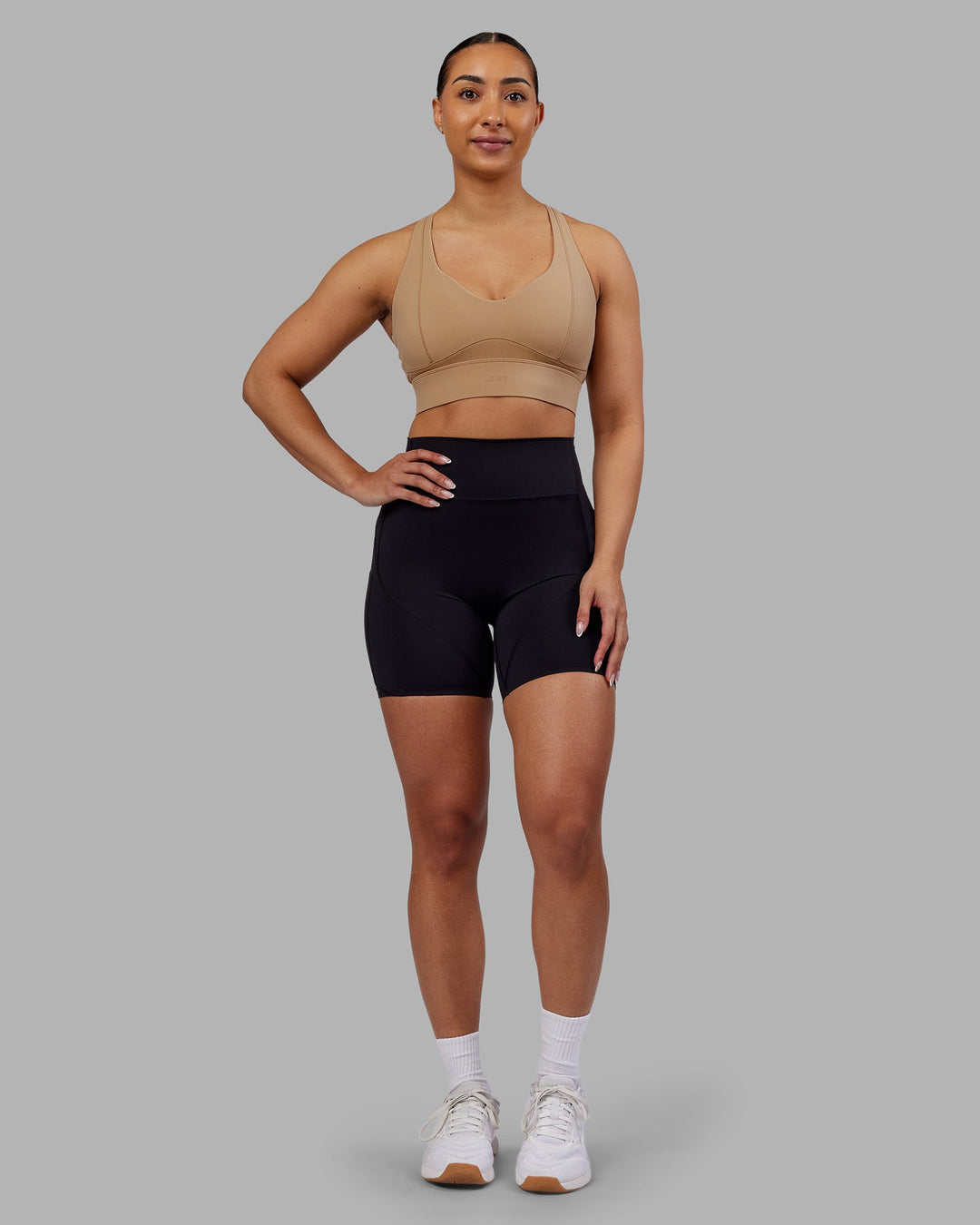Woman wearing Rhythm Elixir Ultra High-Rise 6" Short Pockets - Black | Model:Ayla | Size:S