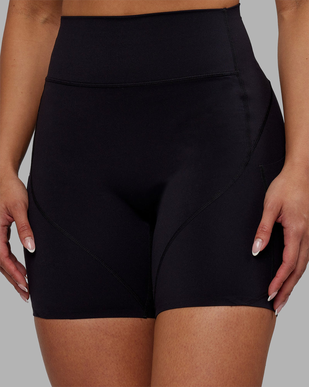 Woman wearing Rhythm Elixir Ultra High-Rise 6" Short Pockets - Black | Model:Ayla | Size:S