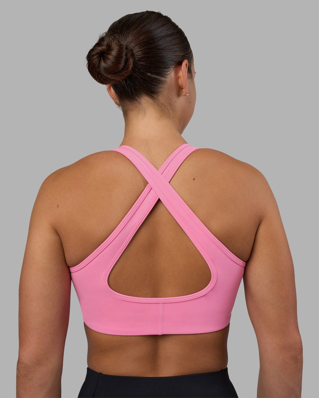 Woman wearing Stamina Sports Bra - Candy Pink | Model:Keisha | Size:S
