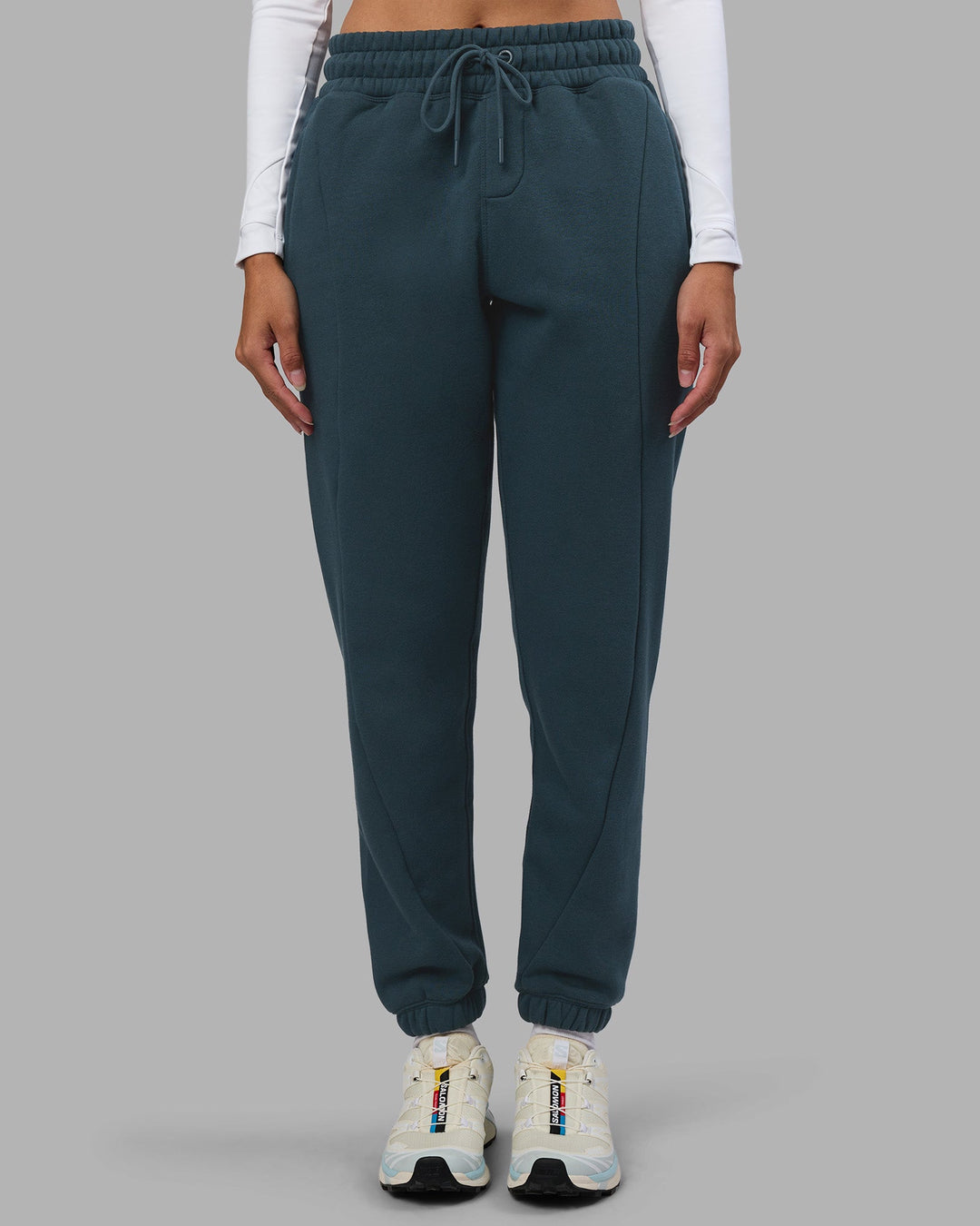 Woman wearing Stream Panel Track Pants - Deep Sea | Model:Rhiley | Size:S