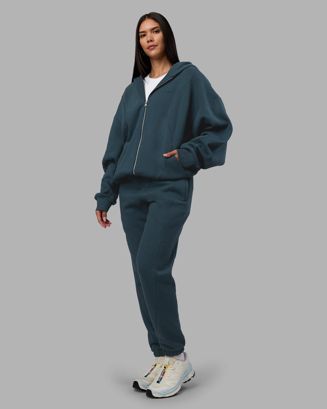 Woman wearing Stream Panel Track Pants - Deep Sea | Model:Rhiley | Size:S