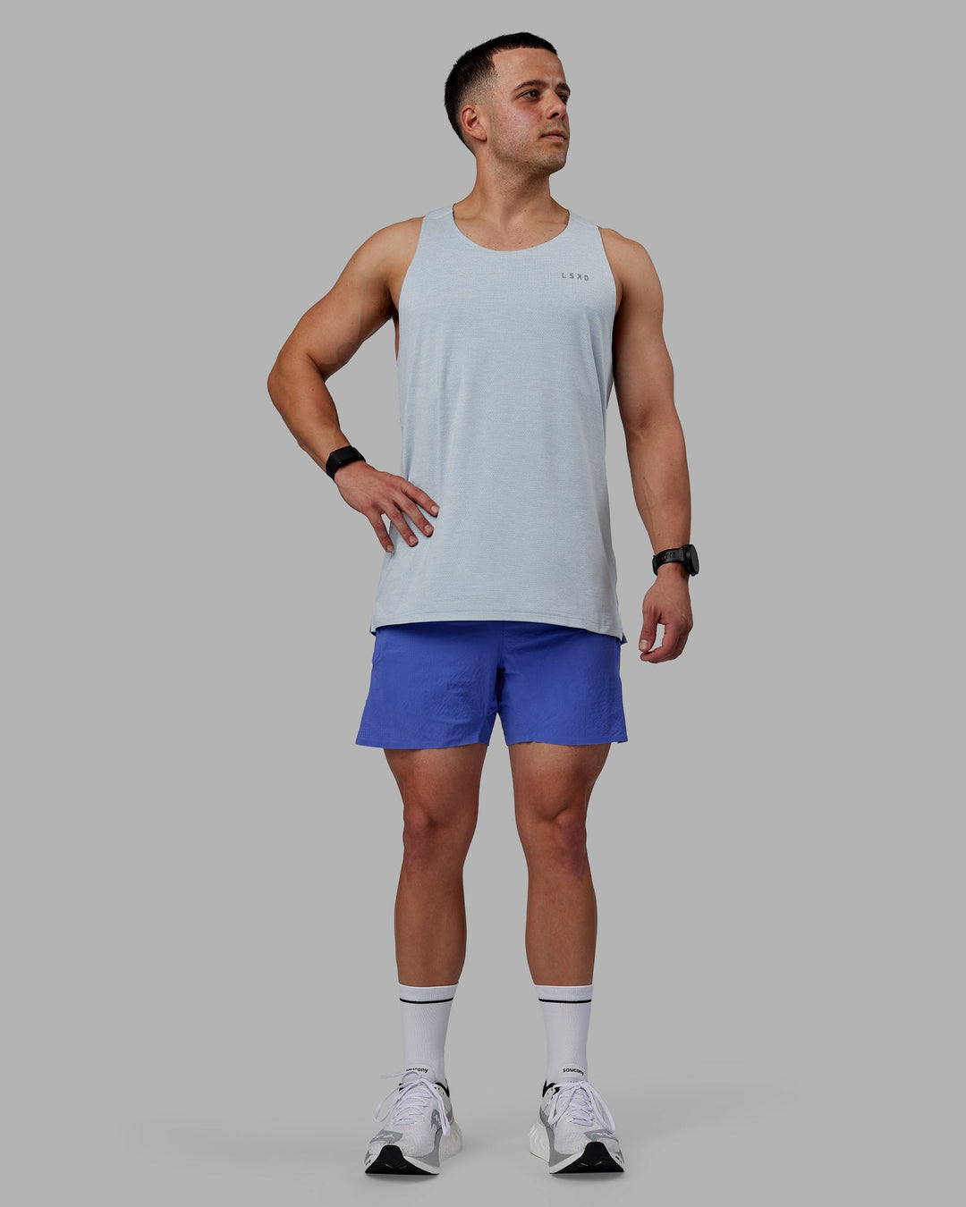 Man wearing UltraAir 5" Lined Performance Shorts - Baja Blue-Reflective