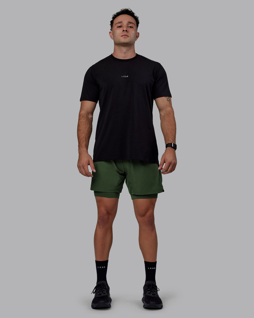 Man wearing Challenger 6" Lined Performance Shorts - Cilantro