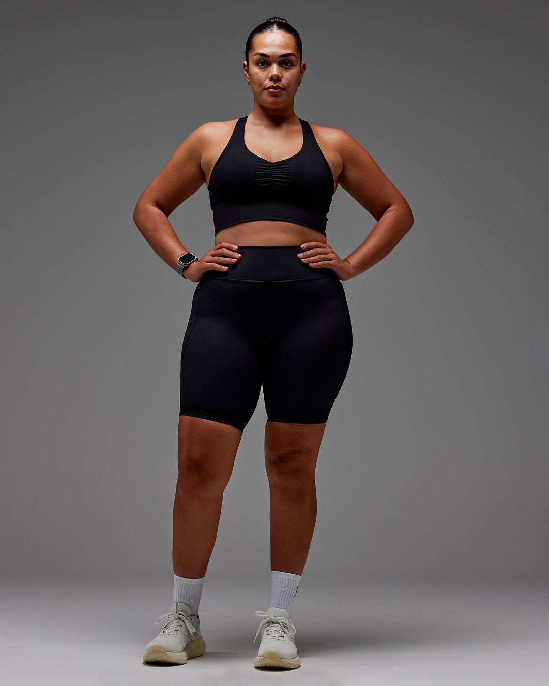 Woman wearing Fusion Ultra High-Rise 9" Short Pockets - Black | Model:Aimee | Size:XL
