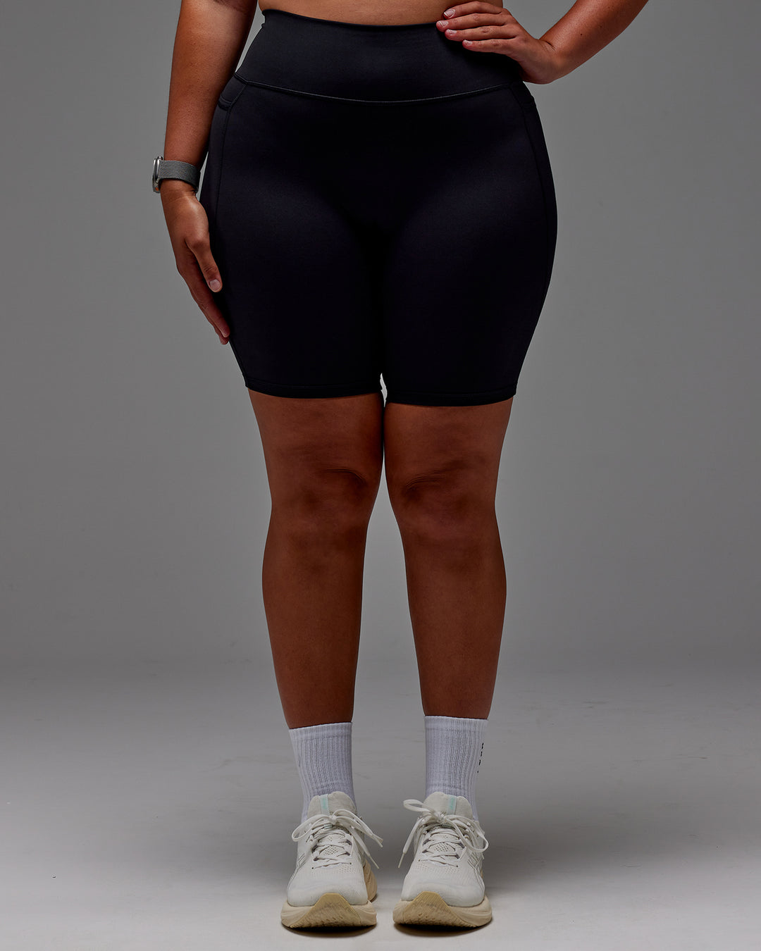 Woman wearing Fusion Ultra High-Rise 9" Short Pockets - Black | Model:Aimee | Size:XL