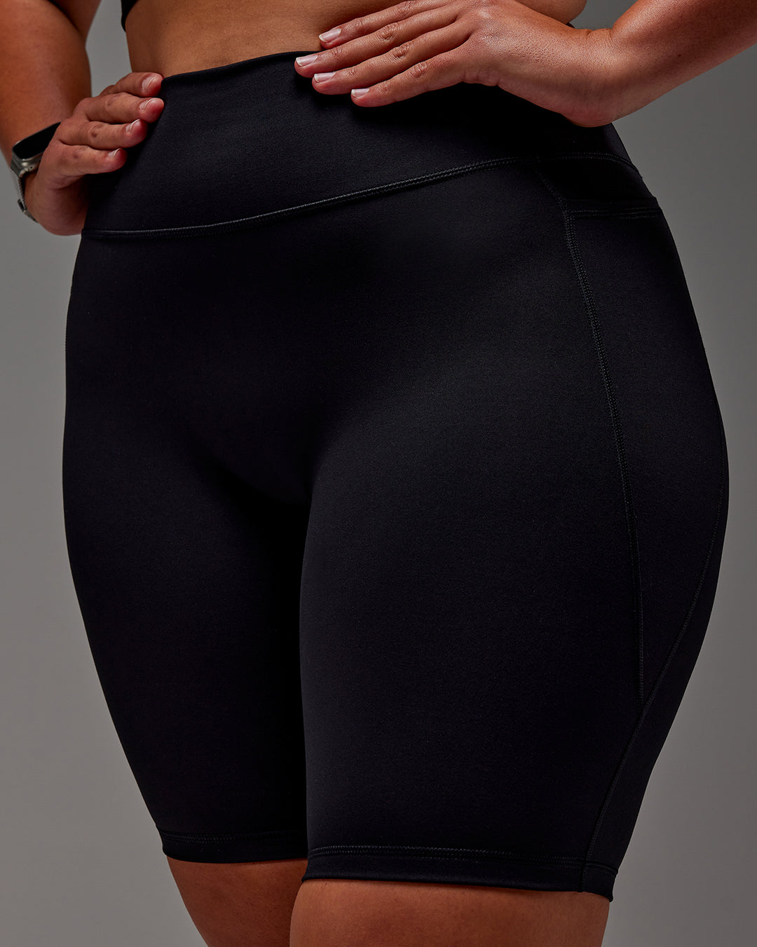 Woman wearing Fusion Ultra High-Rise 9" Short Pockets - Black | Model:Aimee | Size:XL