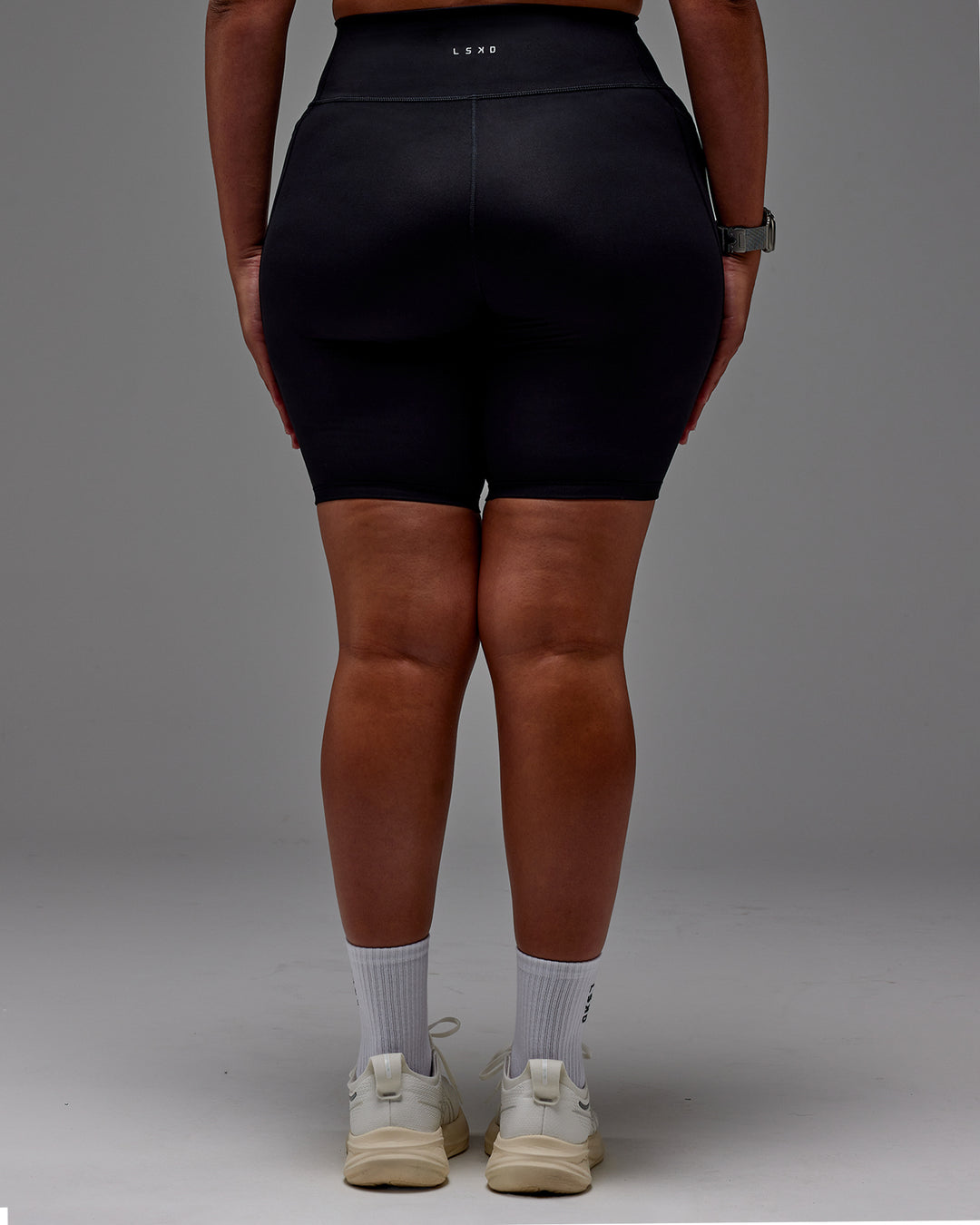 Woman wearing Fusion Ultra High-Rise 9" Short Pockets - Black | Model:Aimee | Size:XL