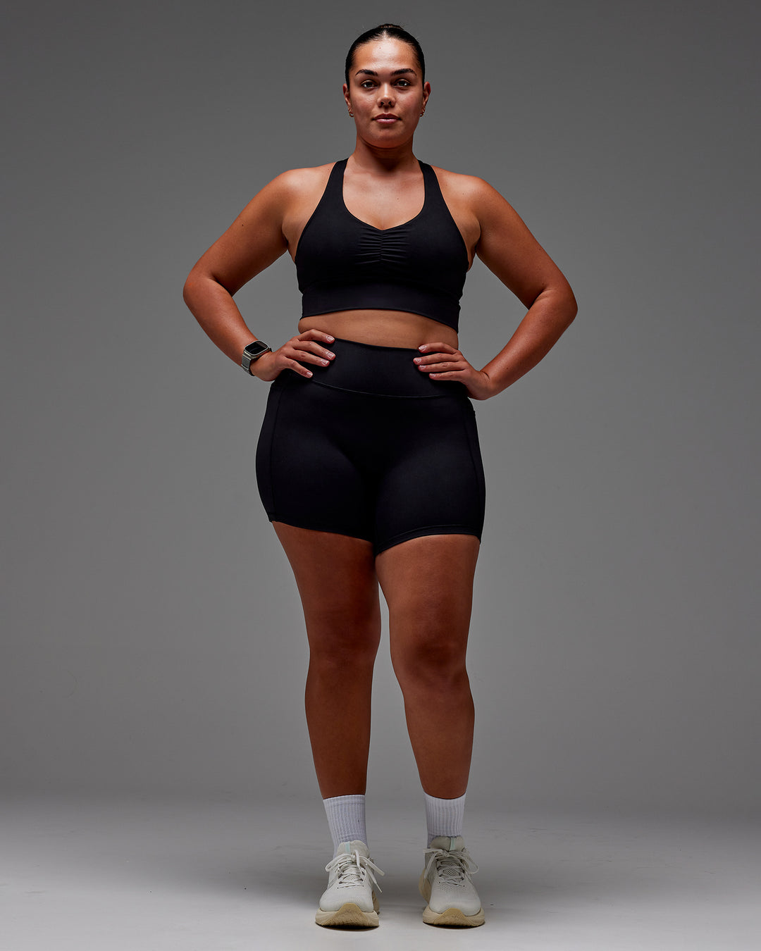 Woman wearing Fusion Ultra High-Rise 6" Short Pockets - Black | Model:Aimee | Size:XL