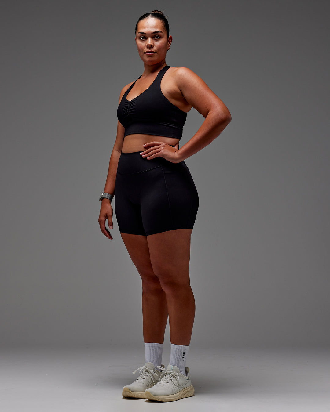 Woman wearing Fusion Ultra High-Rise 6" Short Pockets - Black | Model:Aimee | Size:XL