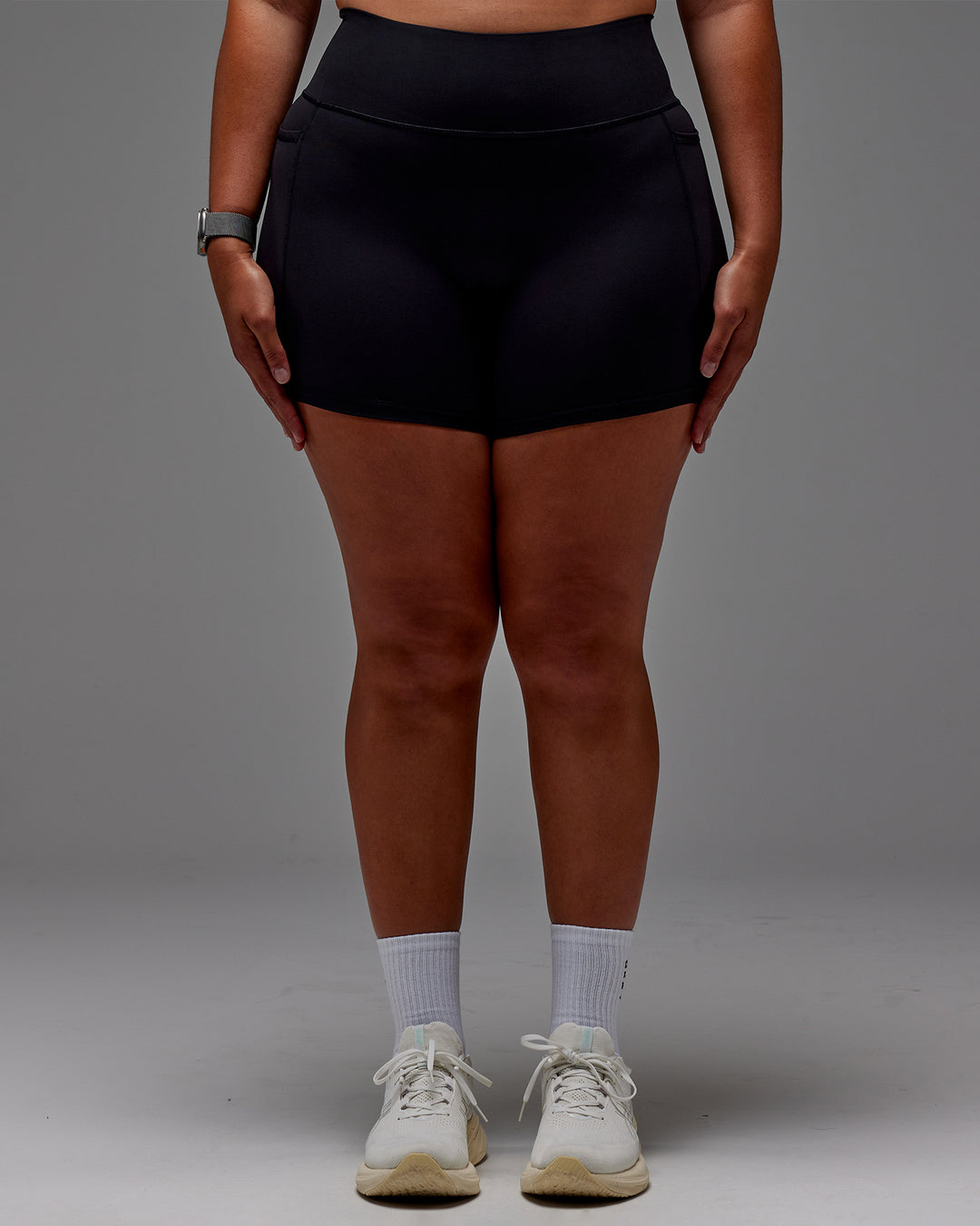 Woman wearing Fusion Ultra High-Rise 6" Short Pockets - Black | Model:Aimee | Size:XL