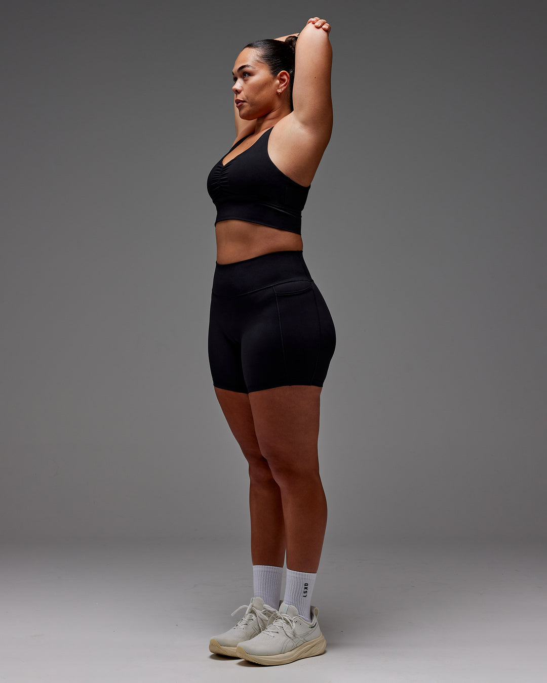 Woman wearing Fusion Ultra High-Rise 6" Short Pockets - Black | Model:Aimee | Size:XL