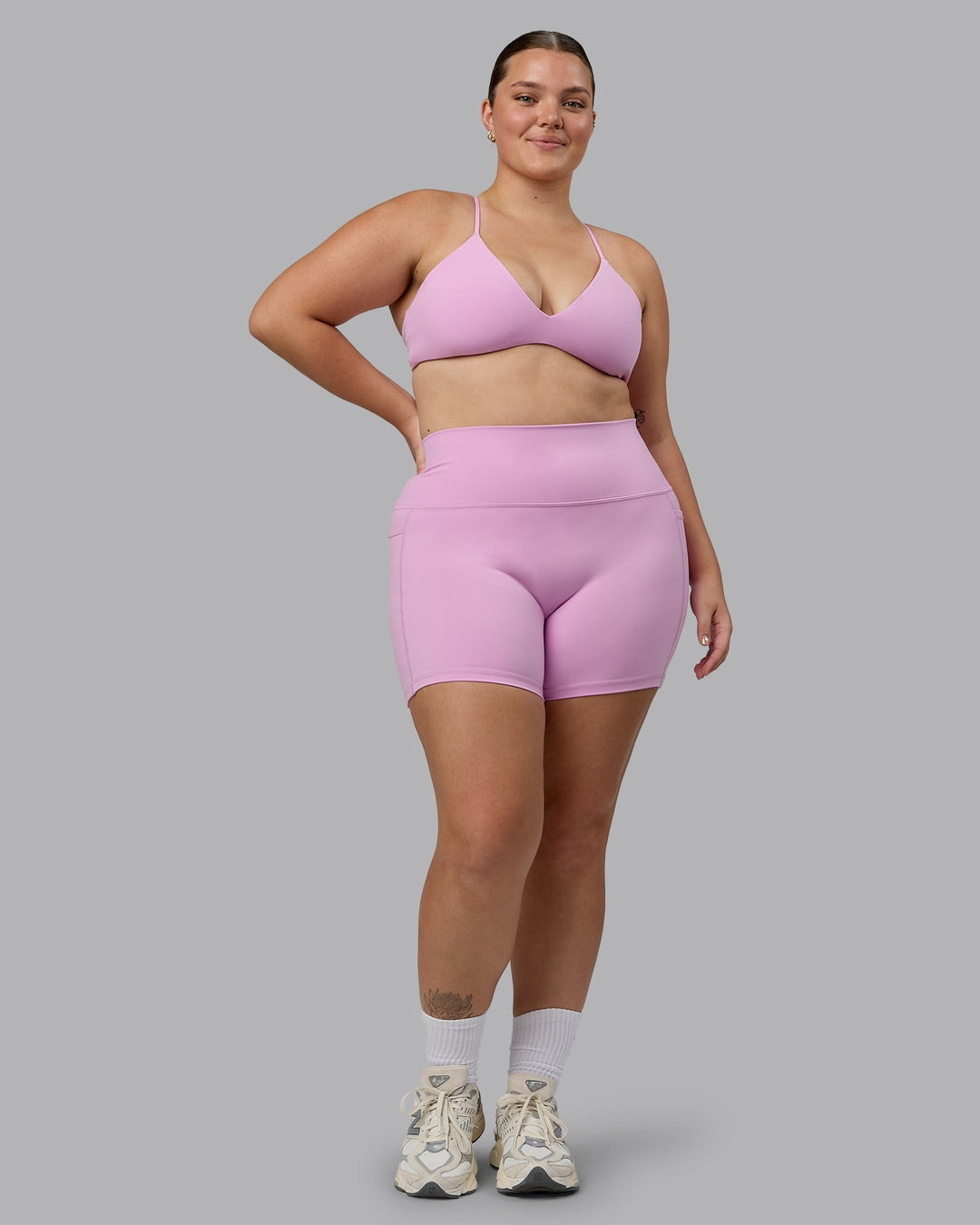 Woman wearing Fusion Ultra High-Rise 4" Short Pockets - Pastel Orchid | Model:Ella | Size:XL