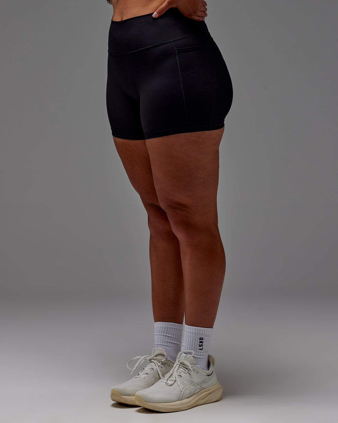 Woman wearing Fusion Ultra High-Rise 4" Short Pockets - Black | Model:Aimee | Size:XL