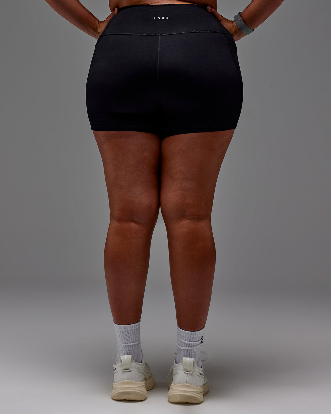 Woman wearing Fusion Ultra High-Rise 4" Short Pockets - Black | Model:Aimee | Size:XL