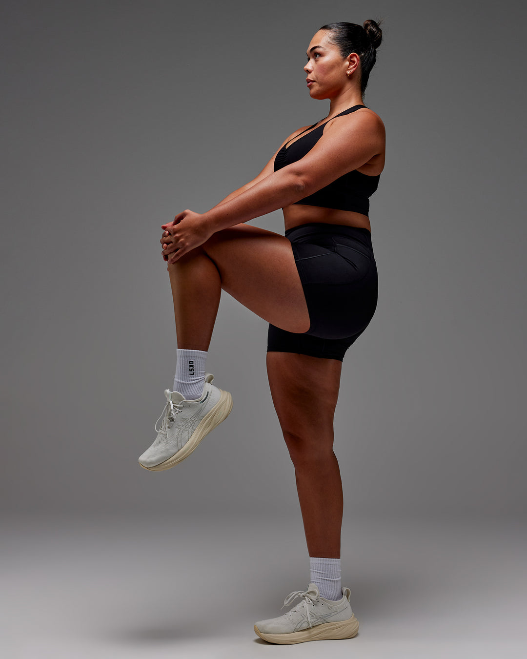 Woman wearing Fusion Ultra High-Rise 4" Short Pockets - Black | Model:Aimee | Size:XL