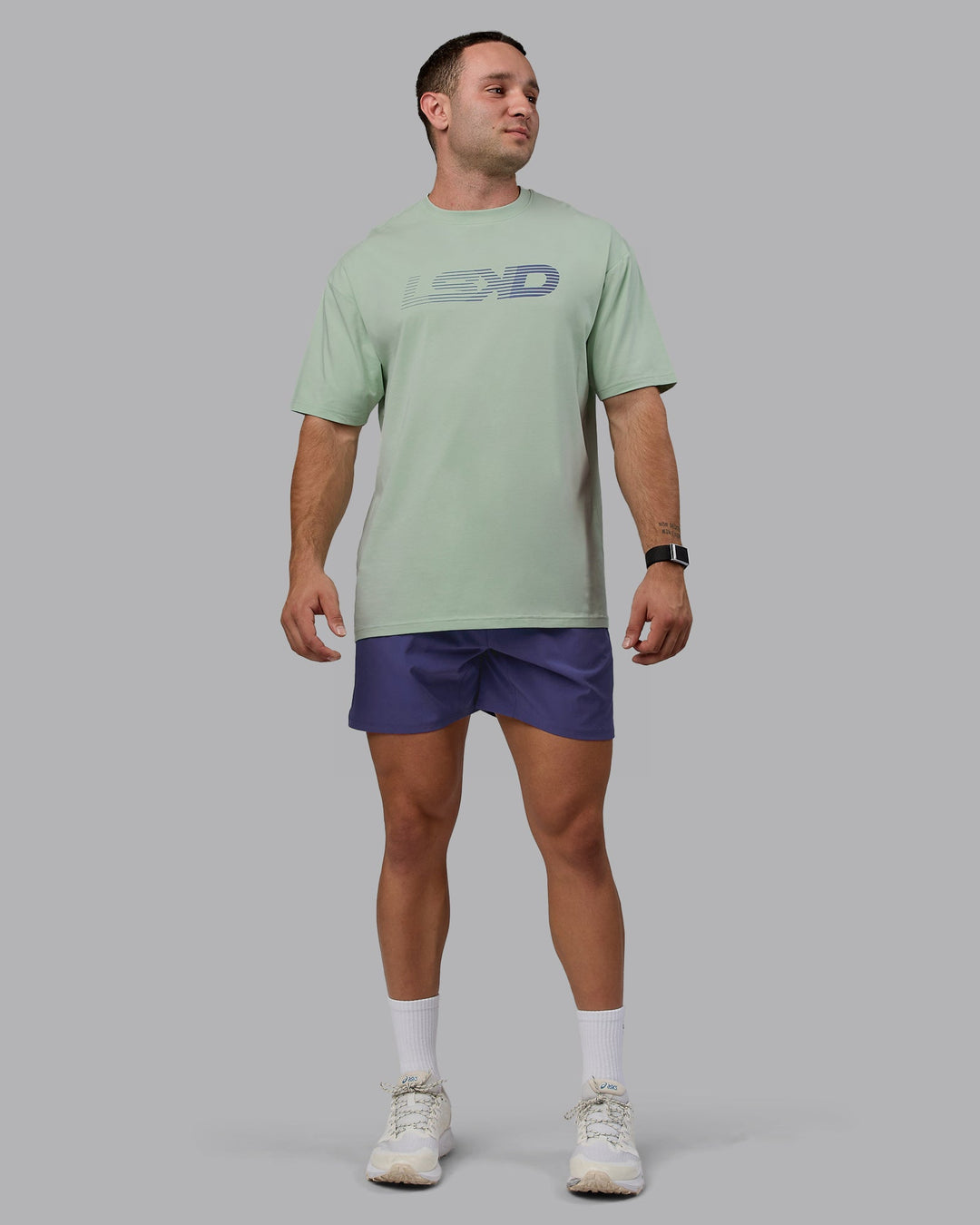 Man wearing Unisex Motion FLXCotton Tee Oversize - Surf Spray-Royal Purple