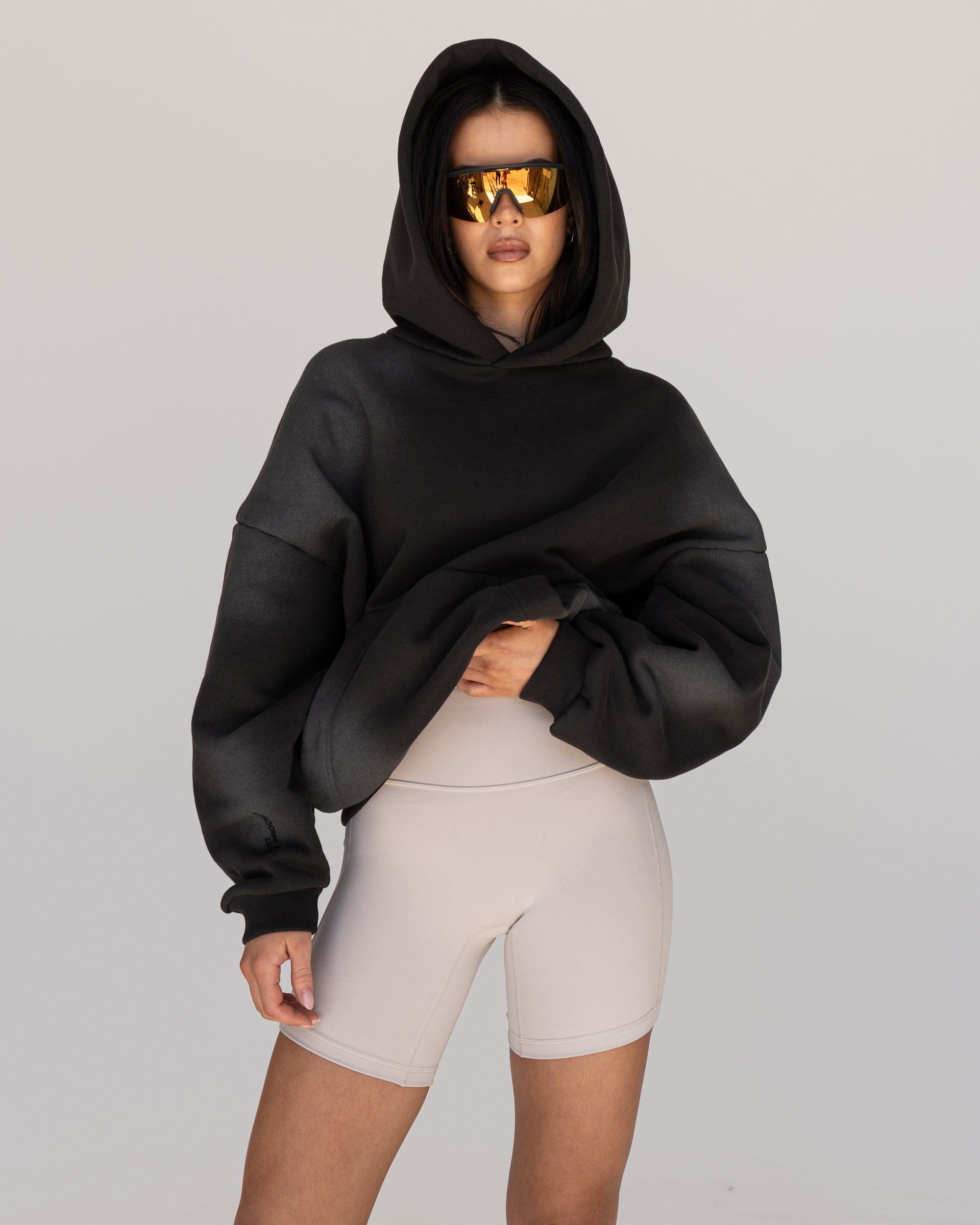 Woman wearing Memory In Motion 500gsm Ultra Heavyweight Washed Hoodie - Charcoal Washed | Model:Eliza | Size:XS