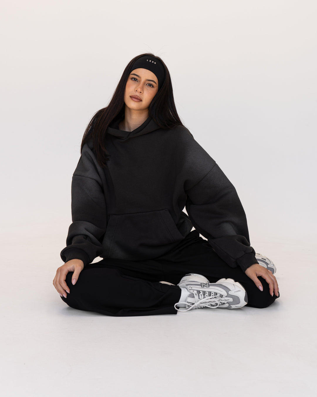 Woman wearing Memory In Motion 500gsm Ultra Heavyweight Washed Hoodie - Charcoal Washed | Model:Eliza | Size:XS