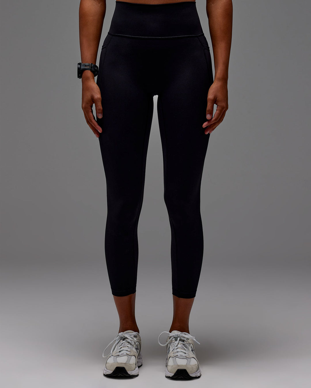 Woman wearing Fusion Ultra High-Rise 7/8 Legging Pockets - Black | Model:Txai | Size:XS