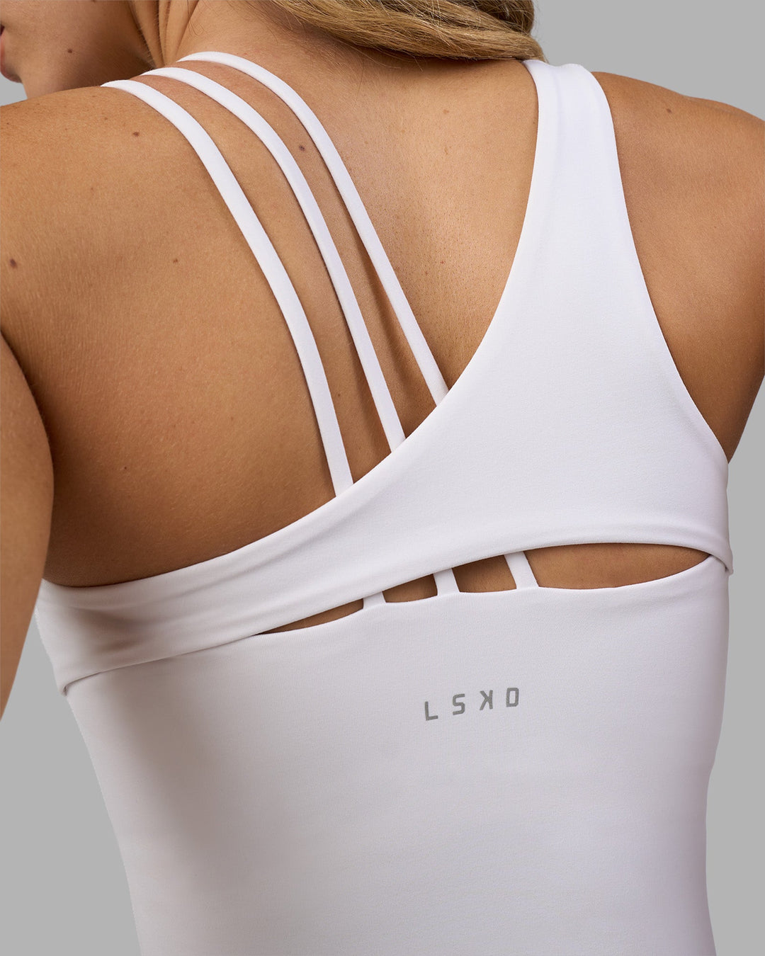 Woman wearing Galvanise Splice Shelf Bra Tank - White | Model:Leilani | Size:XS