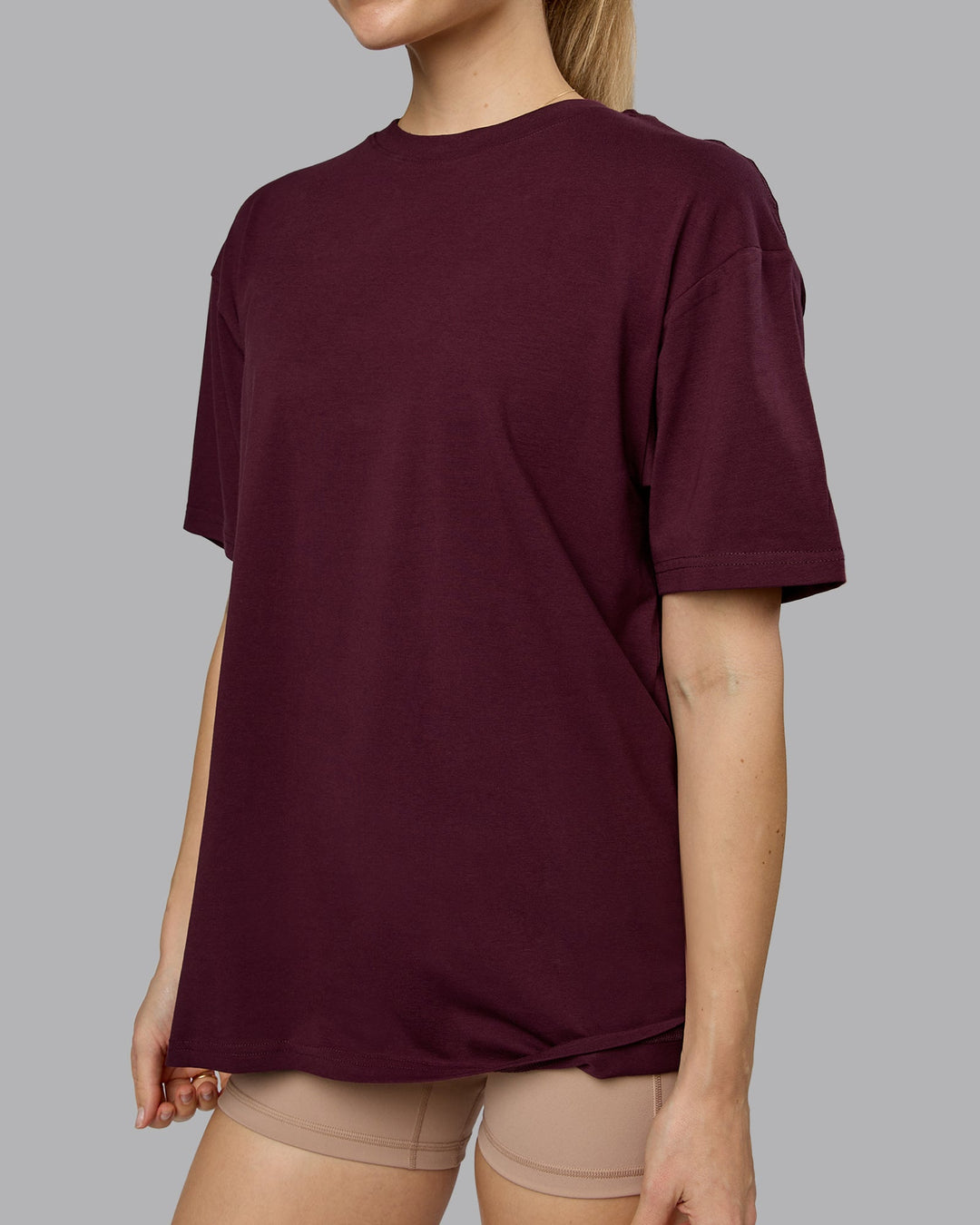 Woman wearing Lifting Club FLXCotton Tee Oversize - Cherry Lacquer-White | Model:Emilie | Size:XS