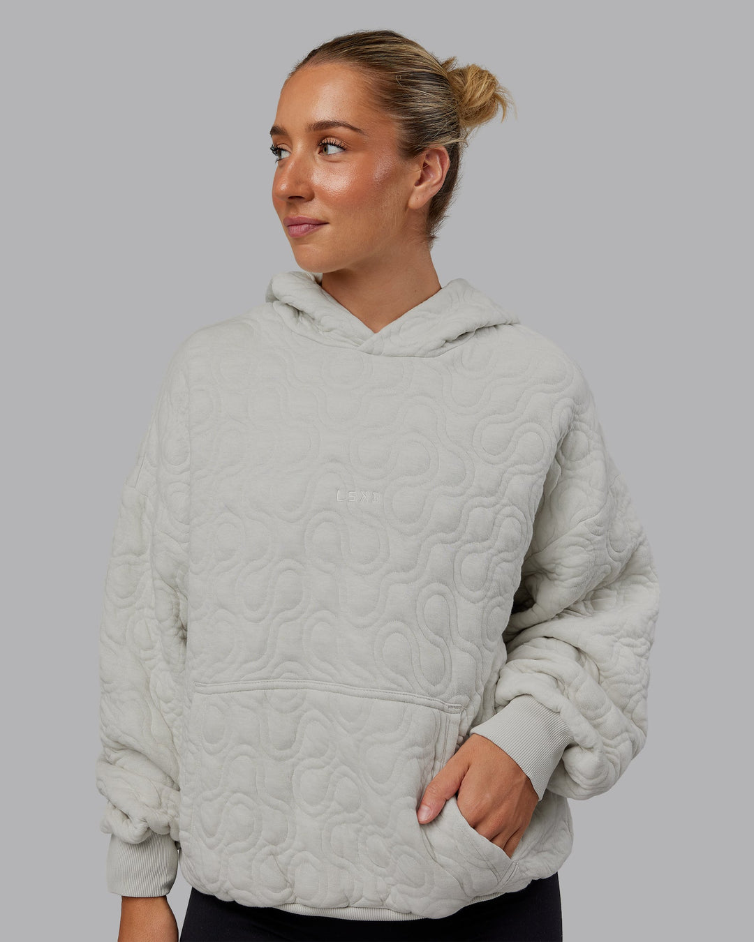Woman wearing MVP Quilted Oversized Hoodie - Digital Mist-Geometric | Model:Lyss | Size:XS