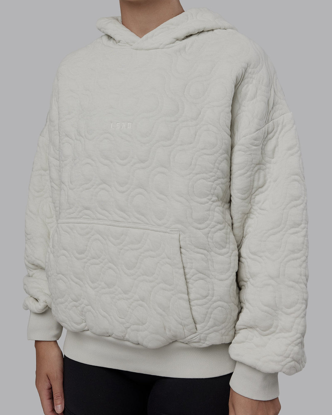 Woman wearing MVP Quilted Oversized Hoodie - Digital Mist-Geometric | Model:Lyss | Size:XS