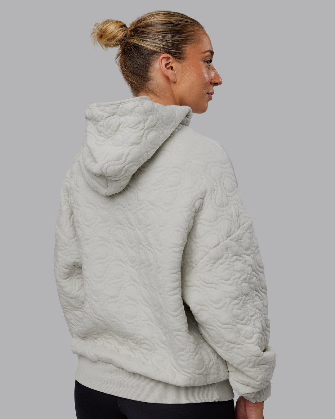Woman wearing MVP Quilted Oversized Hoodie - Digital Mist-Geometric | Model:Lyss | Size:XS