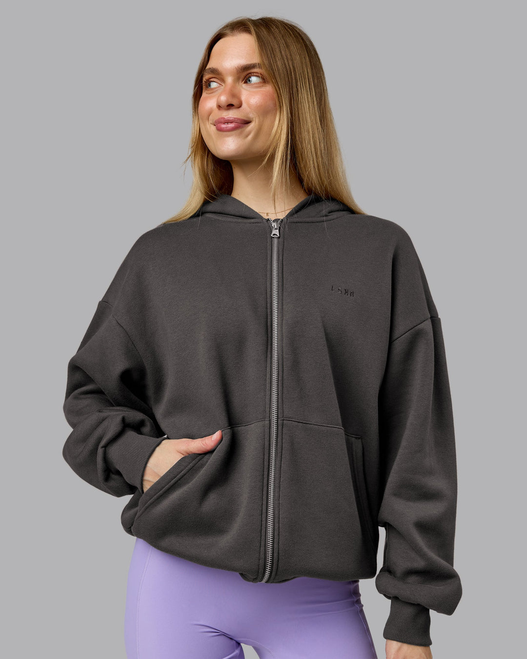 Woman wearing MVP Zip Through Oversized Hoodie - Dark Storm | Model:Emilie | Size:XS