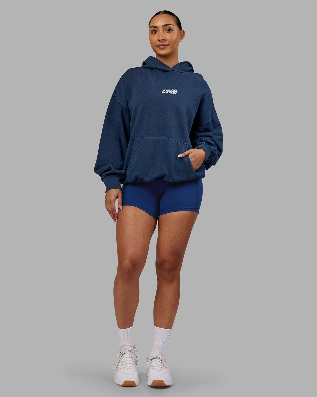 Woman wearing NY25 Washed Oversized Hoodie - Future Navy-Ultra Orange | Model:Ayla | Size:XS