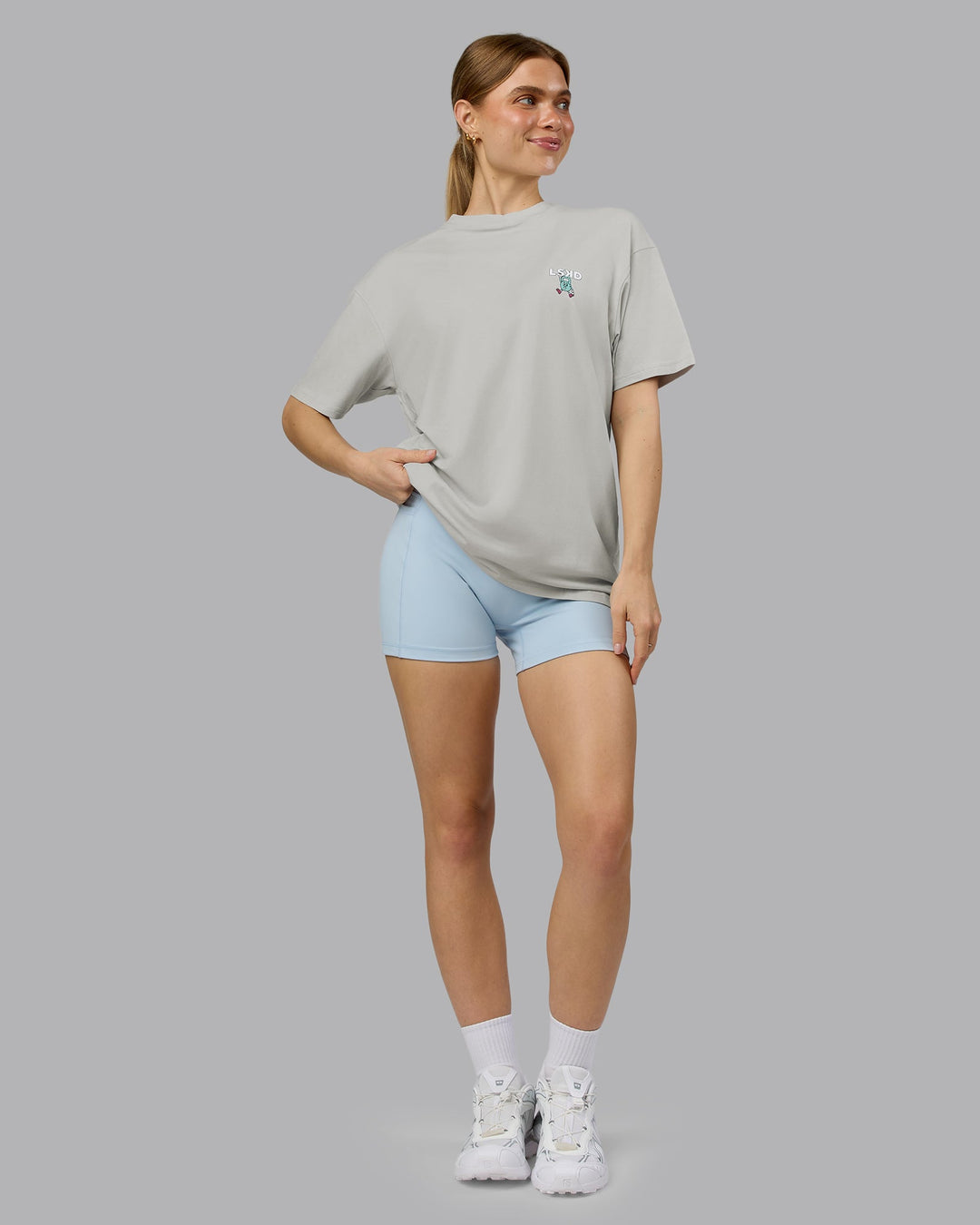 Woman wearing Perspective FLXCotton Oversized Tee - Digital Mist-White | Model:Emilie | Size:XS