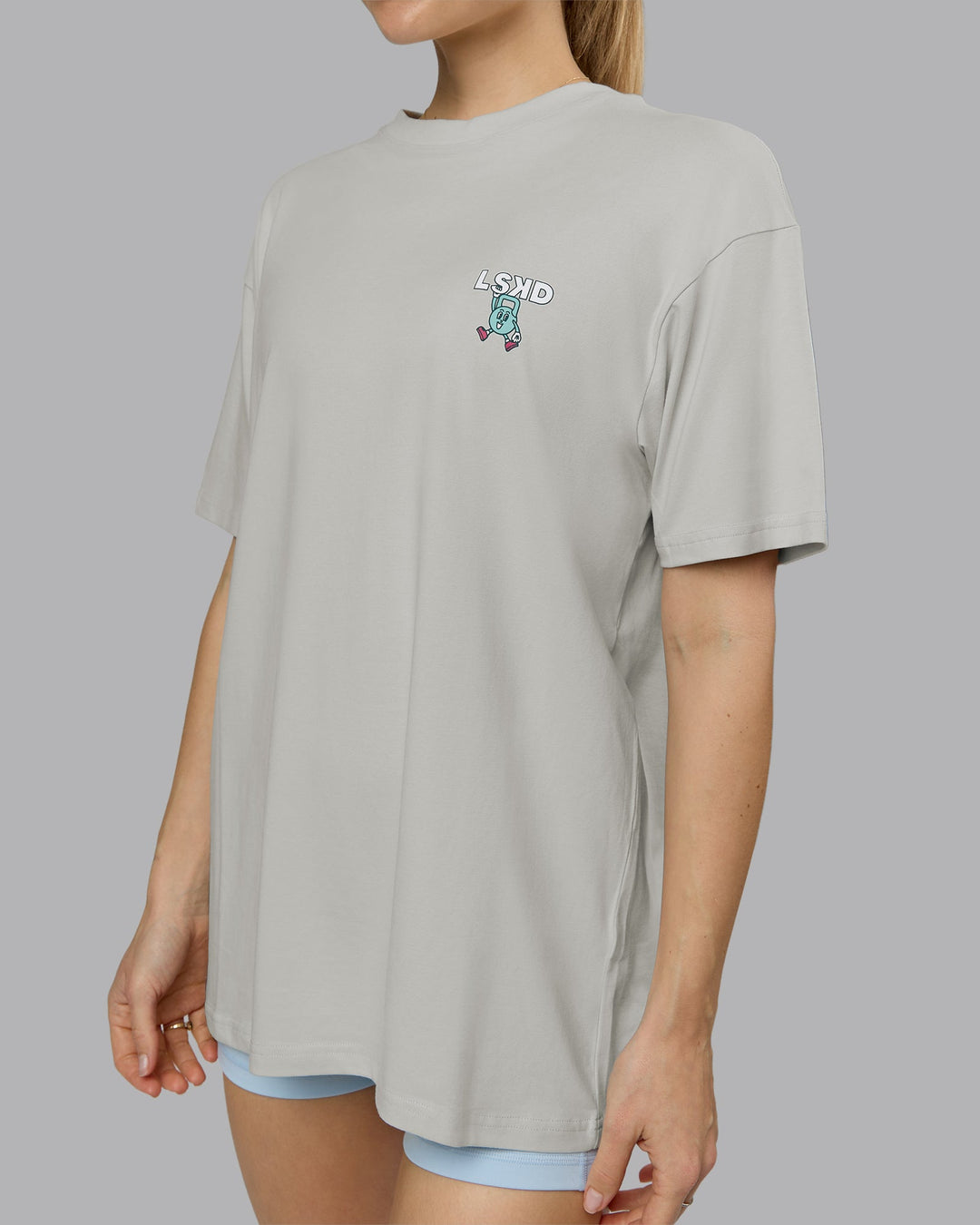 Woman wearing Perspective FLXCotton Oversized Tee - Digital Mist-White | Model:Emilie | Size:XS