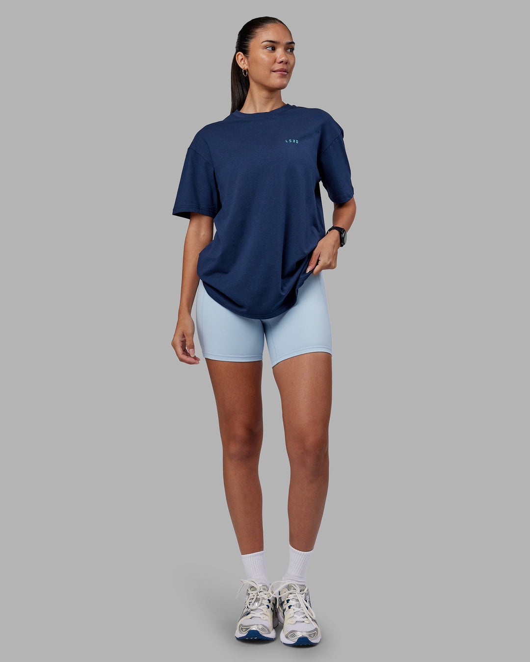 Woman wearing Enjoy the Journey Value Series FLXCotton Tee Oversize - Future Navy-Blue Atoll | Model:Rhiley | Size:XS