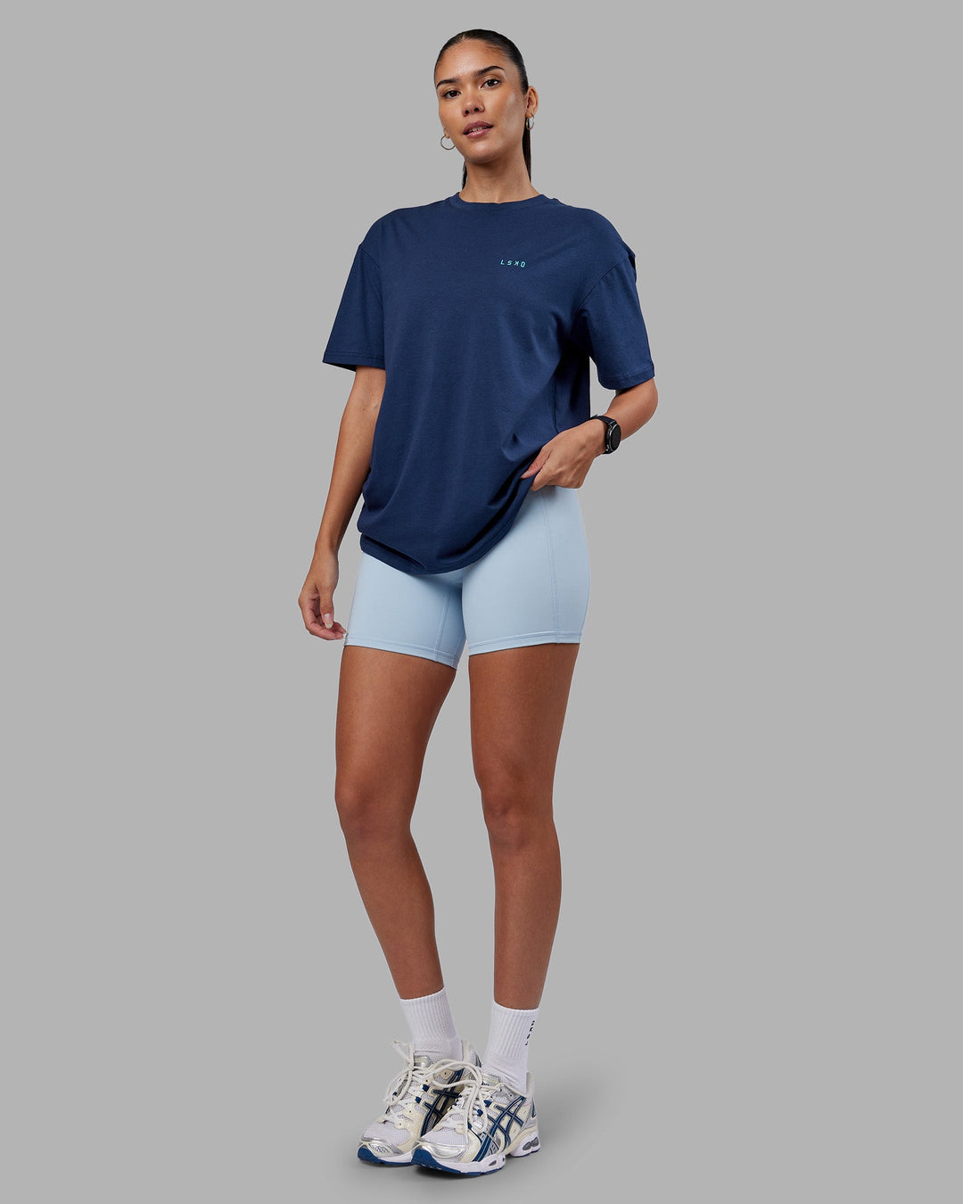 Woman wearing Enjoy the Journey Value Series FLXCotton Tee Oversize - Future Navy-Blue Atoll | Model:Rhiley | Size:XS