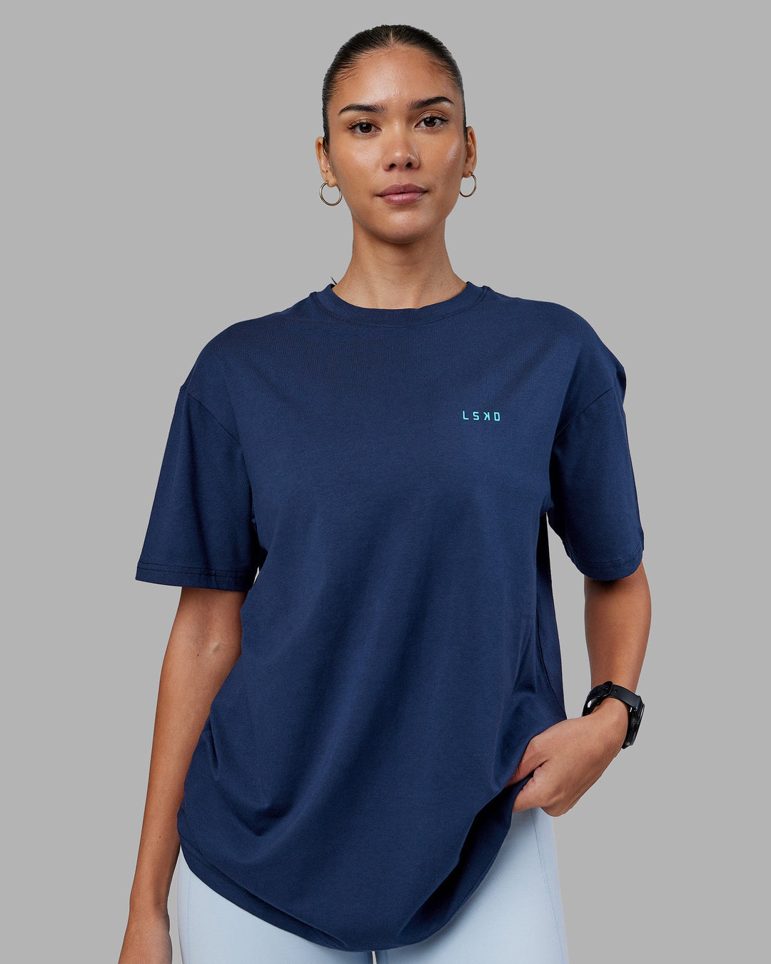 Woman wearing Enjoy the Journey Value Series FLXCotton Tee Oversize - Future Navy-Blue Atoll | Model:Rhiley | Size:XS
