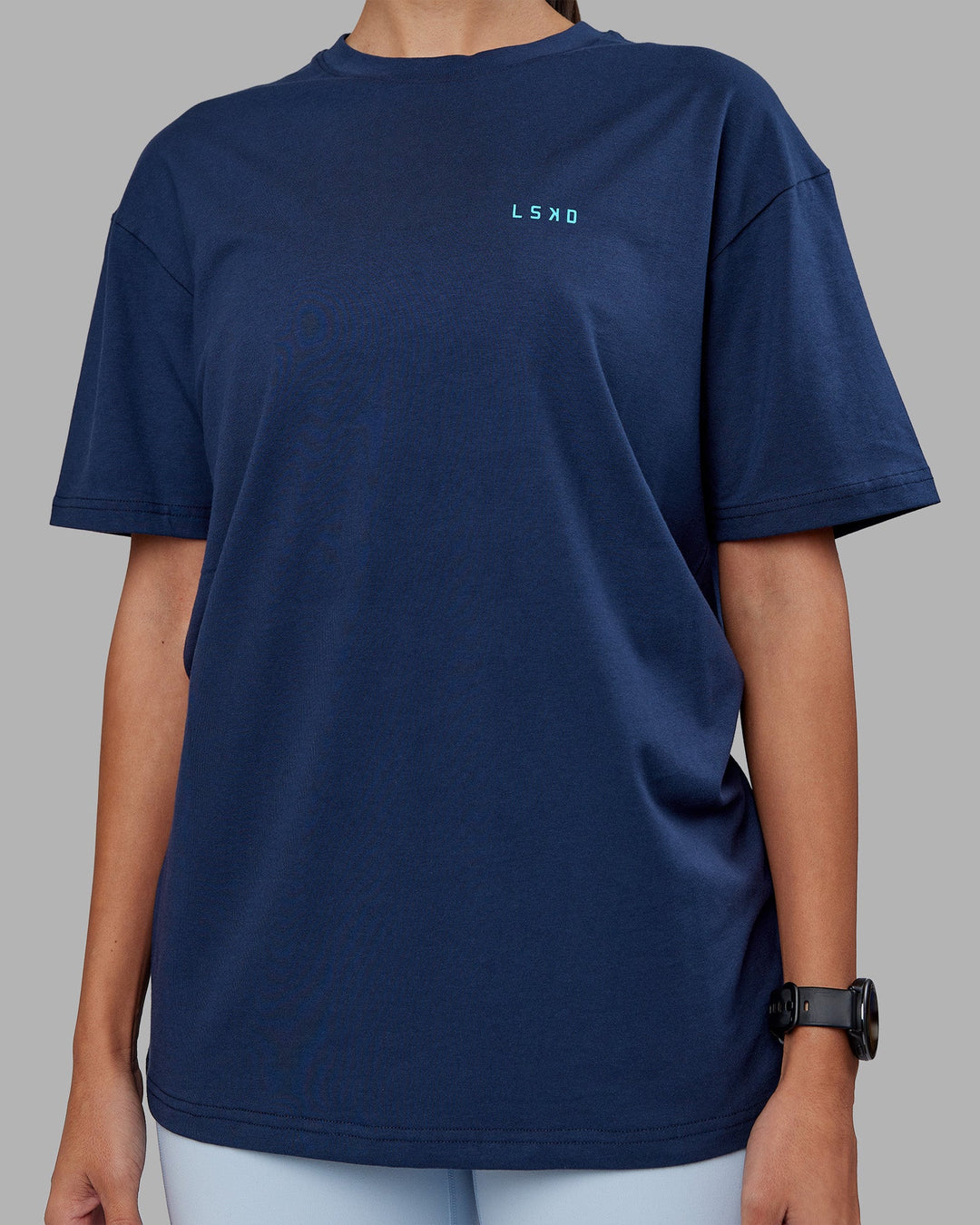 Woman wearing Enjoy the Journey Value Series FLXCotton Tee Oversize - Future Navy-Blue Atoll | Model:Rhiley | Size:XS