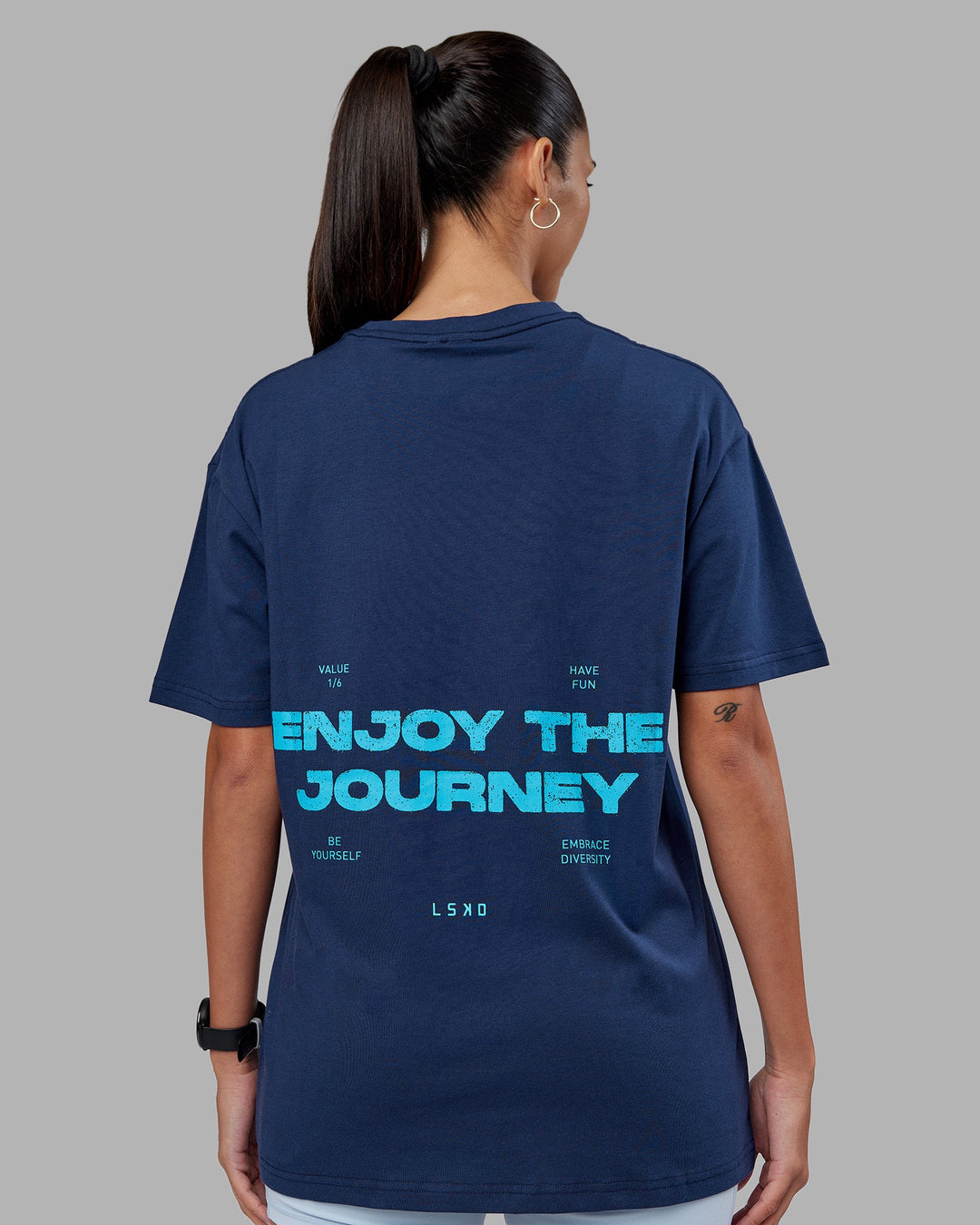 Woman wearing Enjoy the Journey Value Series FLXCotton Tee Oversize - Future Navy-Blue Atoll | Model:Rhiley | Size:XS