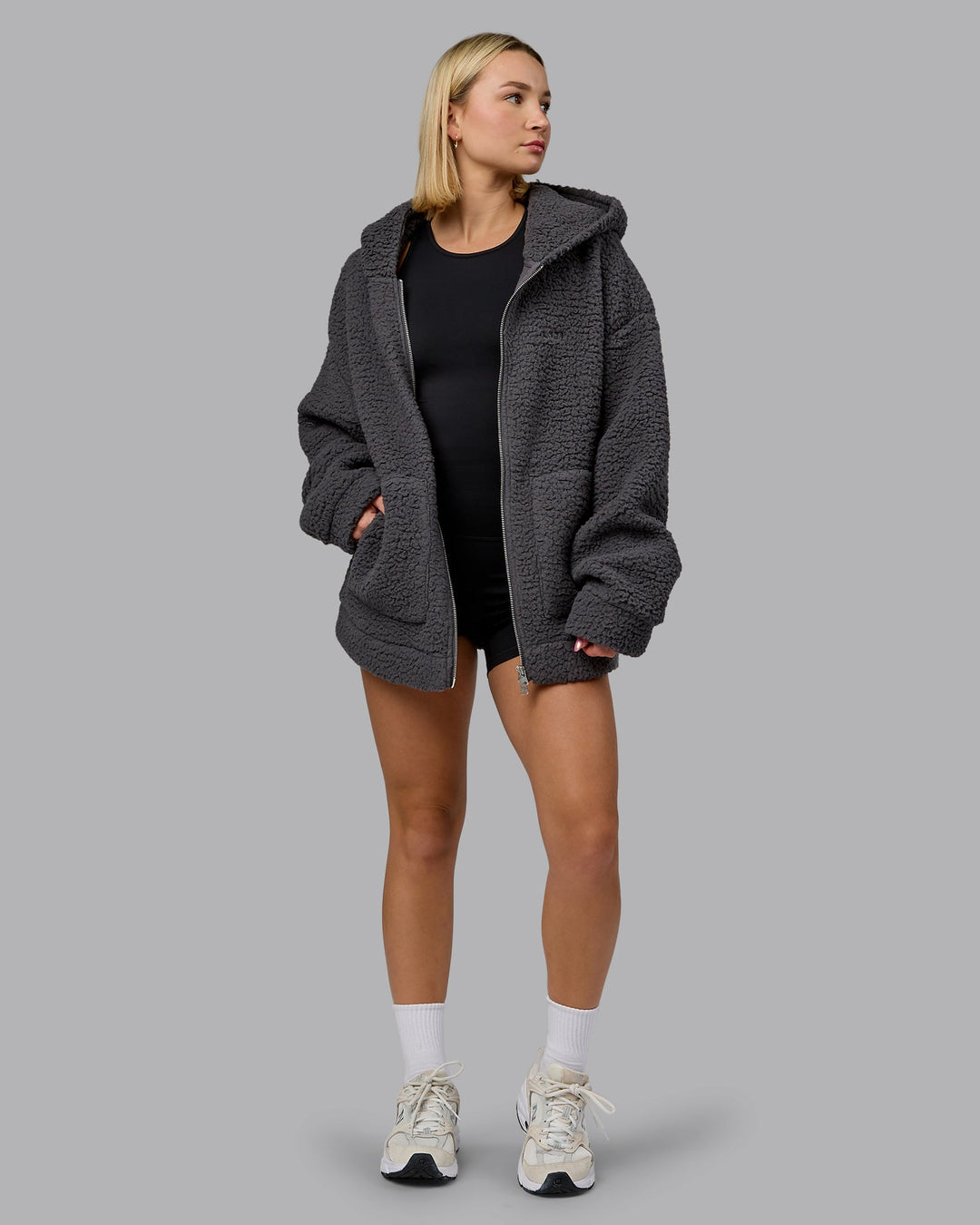 Woman wearing Sherpa Oversized Jacket - Dark Storm | Model:Halle | Size:XS