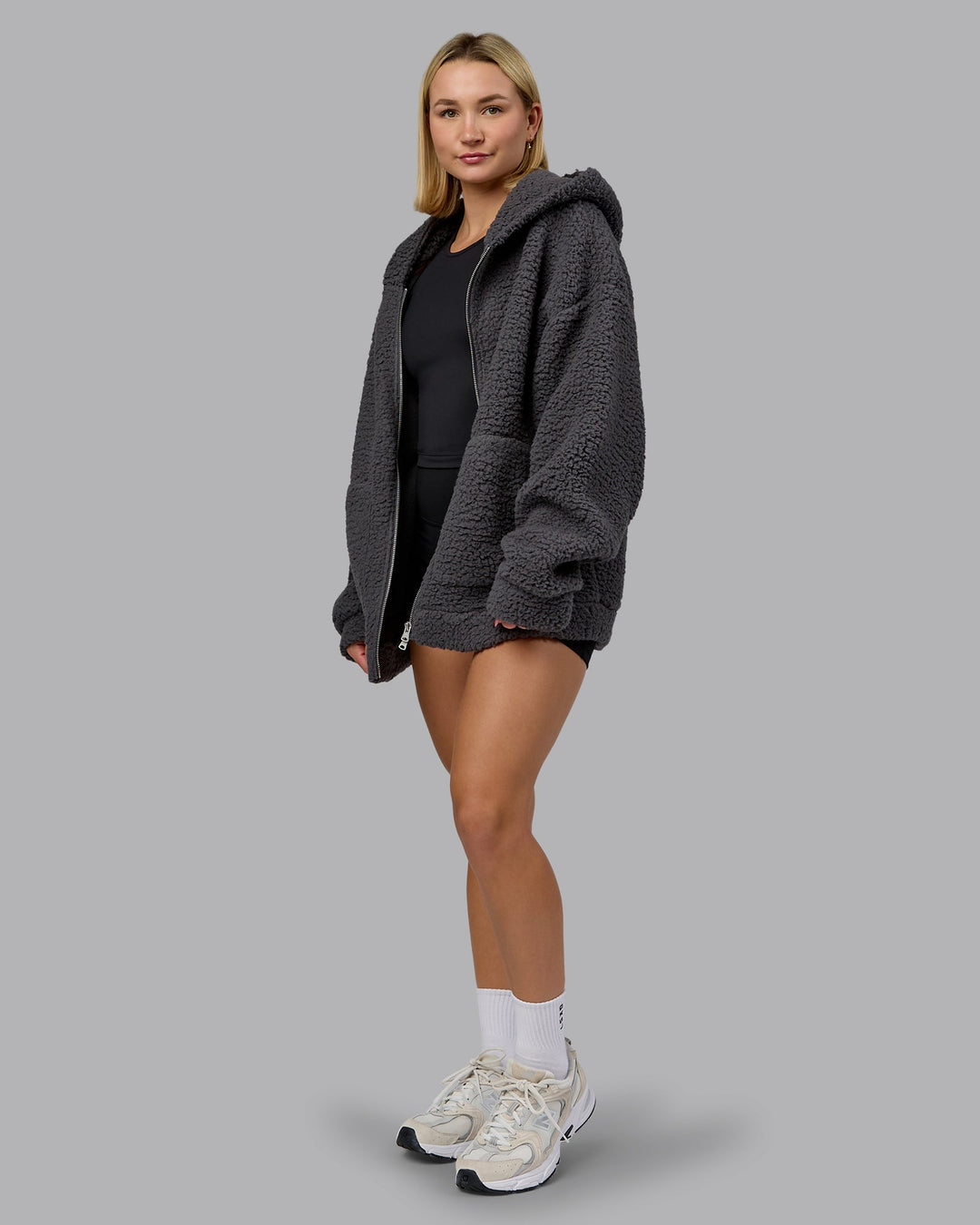Woman wearing Sherpa Oversized Jacket - Dark Storm | Model:Halle | Size:XS