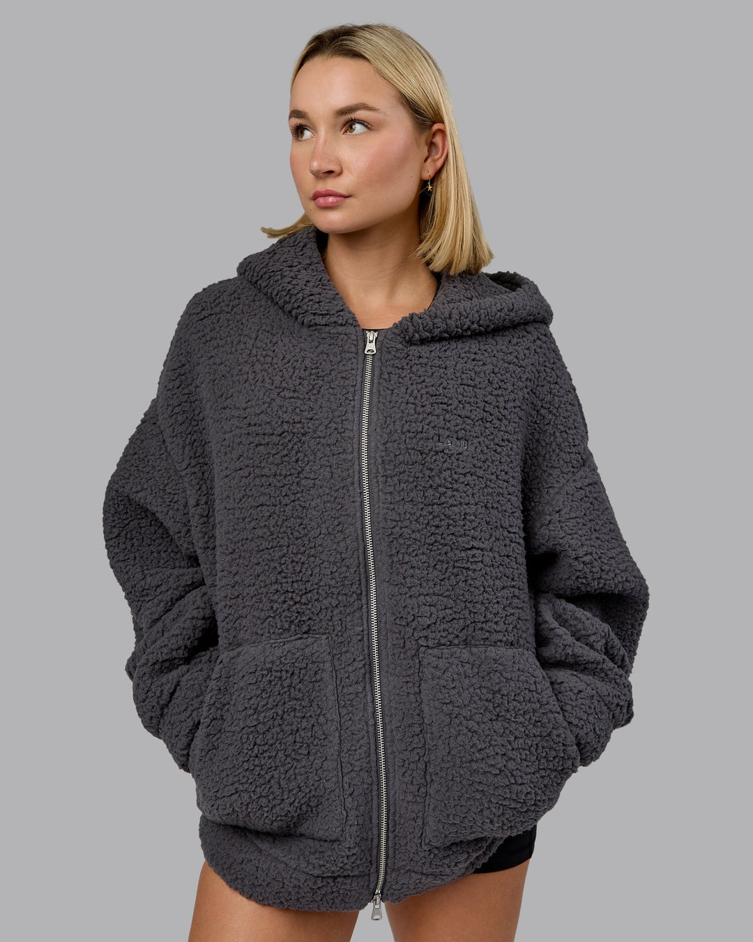 Woman wearing Sherpa Oversized Jacket - Dark Storm | Model:Halle | Size:XS