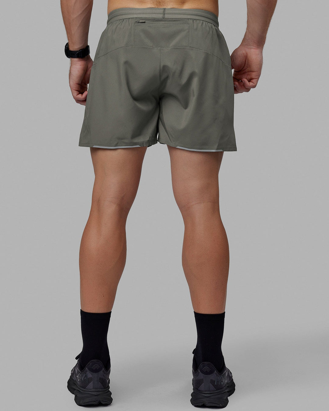 Man wearing Pace 5" Lined Performance Short - Graphite-Reflective