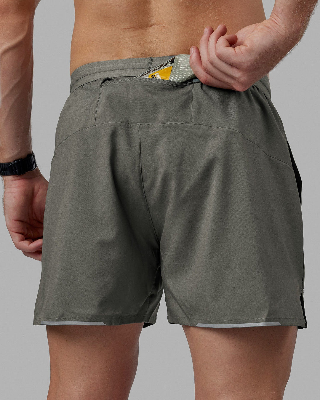 Man wearing Pace 5" Lined Performance Short - Graphite-Reflective