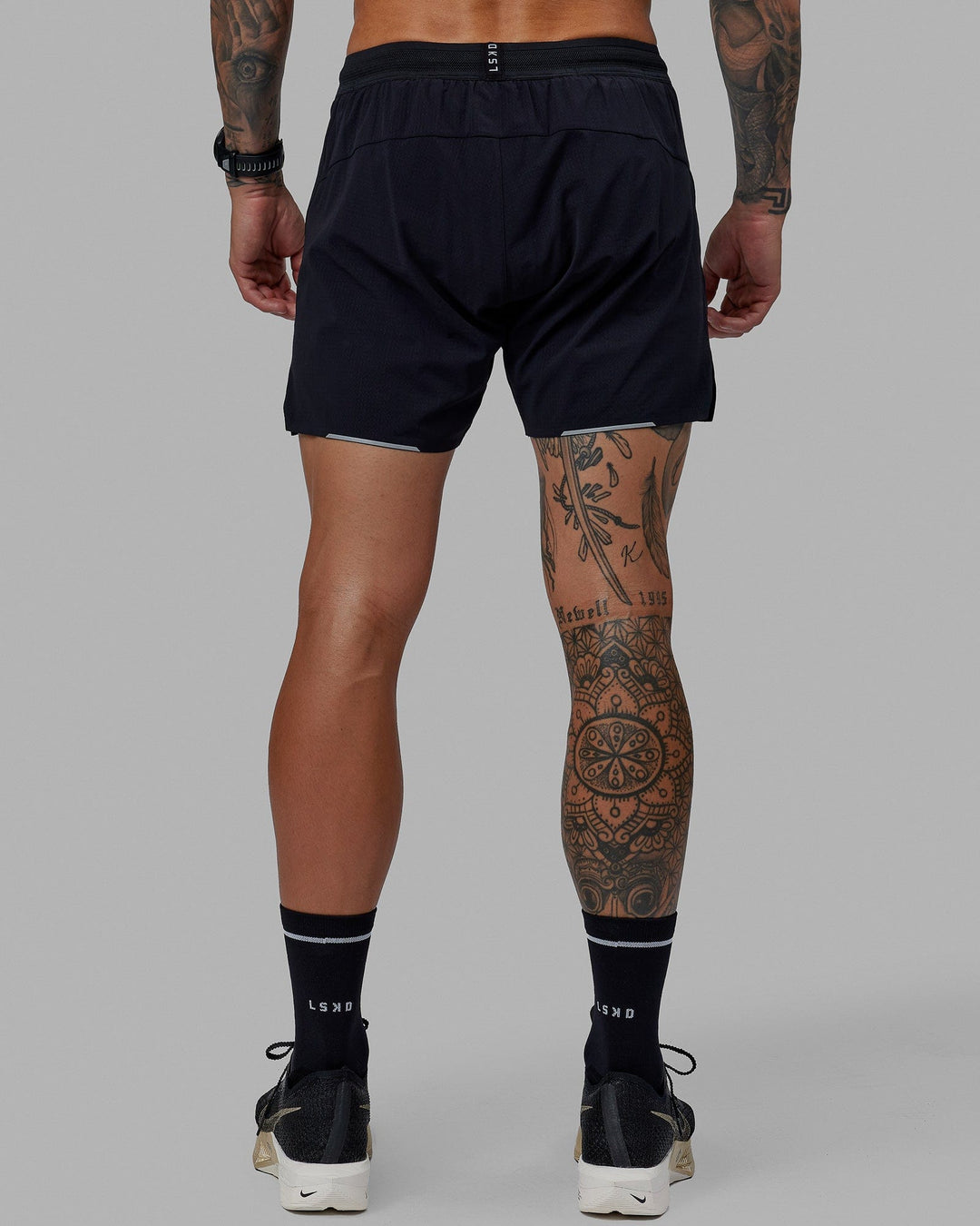 Man wearing UltraAir 5" Lined Performance Short - Black-Reflective