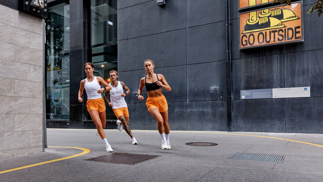 group of people running in the city