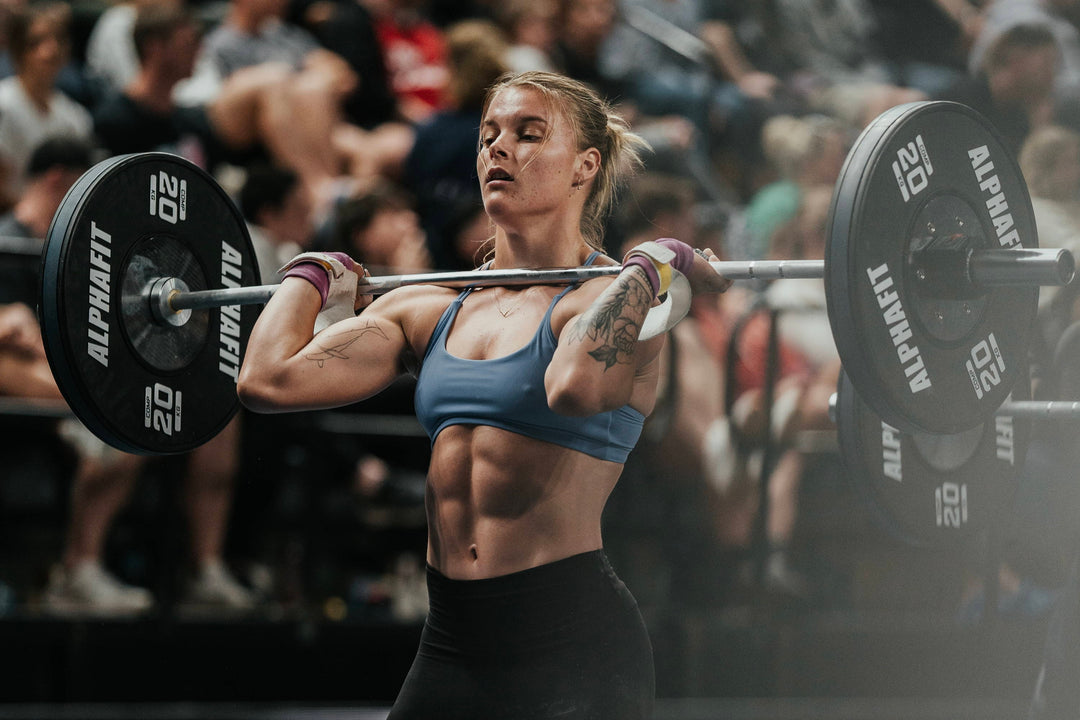 girl lifting a weight at a crossfit competition
