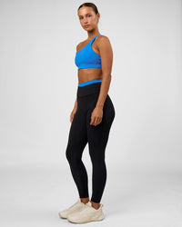 Woman wearing Liberate High-Rise Full Length Legging Pockets - Black-Palace Blue | Model:Brylee | Size:XS