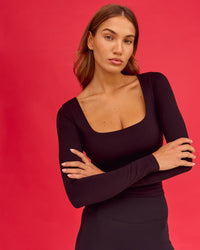 Woman wearing Show It Off Long Sleeve Top in Black 