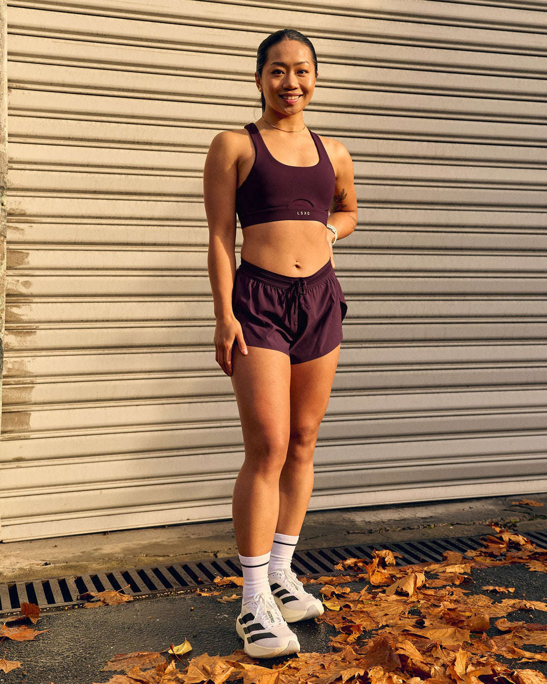 Woman wearing Fast-Track Sports Bra - Cherry Lacquer