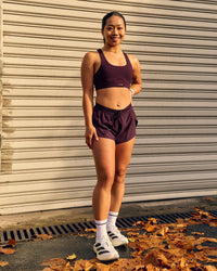 Woman wearing Fast-Track Sports Bra - Cherry Lacquer